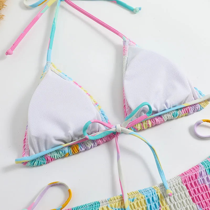 Women's multicolour floral triangle bag bikini swimsuit with split printed design and smocking craft detail.