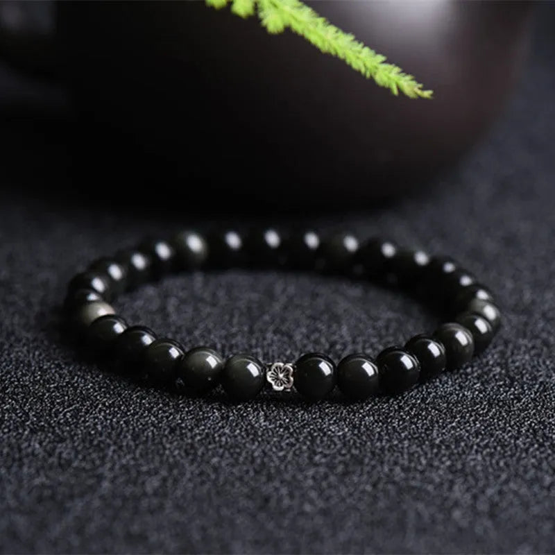 Natural obsidian bracelet with S925 silver flower charm and dragon phoenix constellation design
