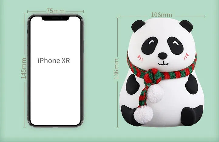 Panda-shaped soft silicone night light with USB rechargeable battery on a table.