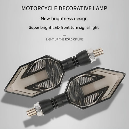Arrow-shaped 12V LED motorcycle turn signal light in yellow with choice of blue, red, or white accent.