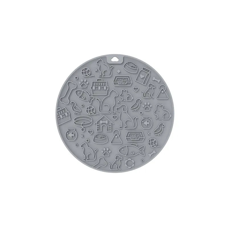 Round blue silicone pet licking mat with textured surface and a clear sucker base on the bottom.