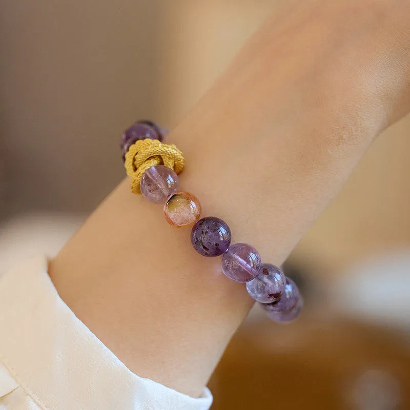 Purple crystal bracelet with nine charms, animal zodiac motifs, and 10mm beads
