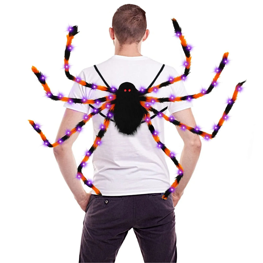 Orange Halloween spider backpack with glowing LED lights on a model, showing plush fabric.