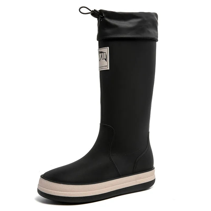 A pair of high tube PVC rain boots for men and women in a choice of colours.
