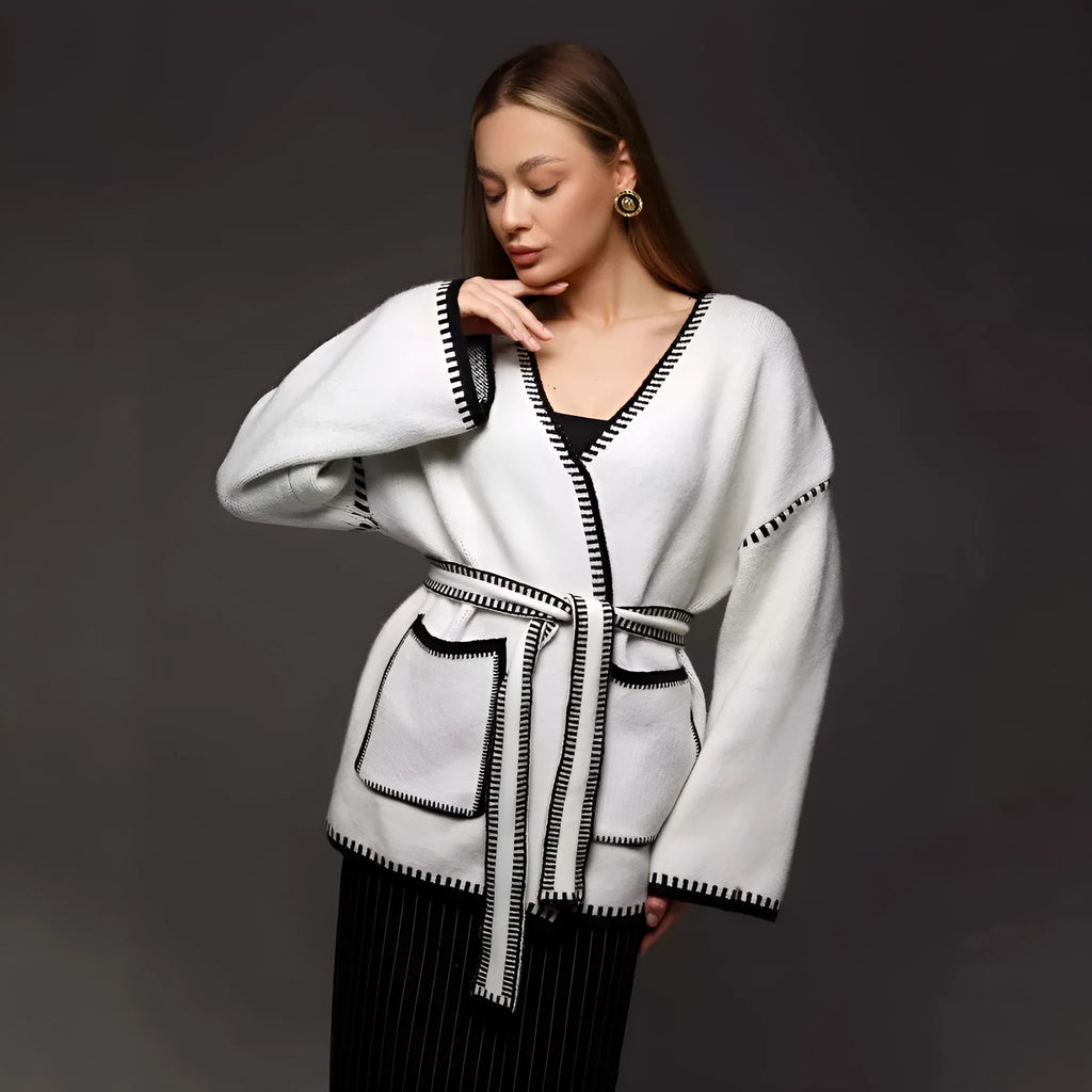 Loose mid-length knitted cardigan with lace-up front, in white, black, or camel.