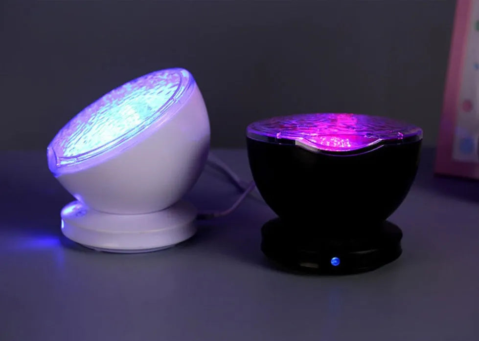 White and blue ocean wave projector LED night light with remote control, measuring 13x12x12 cm