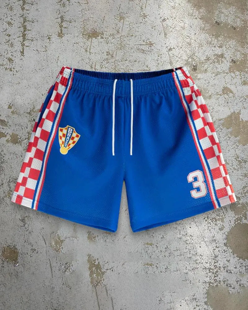 Man wearing loose-fitting digital print beach shorts in a contemporary colour, showing the elastic waistband and quick-dry milk silk fabric.