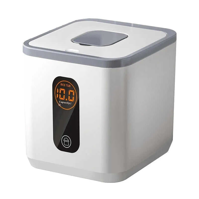 Grey plastic household rice storage jar with a sealed lid, shown with a measuring cup.