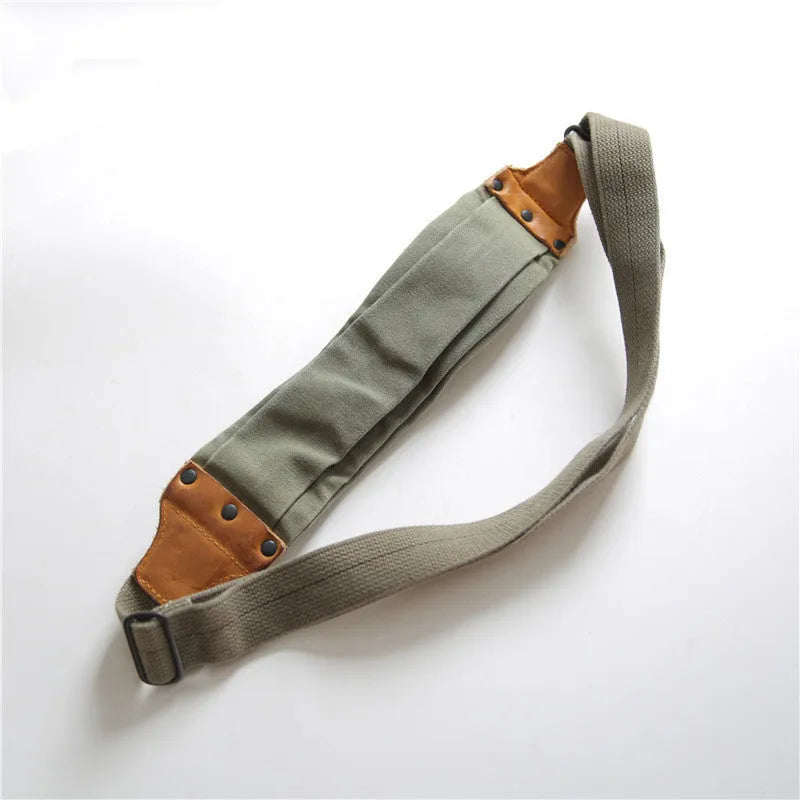 Green American retro military-style chest bag made of washed canvas with Italian leather accents