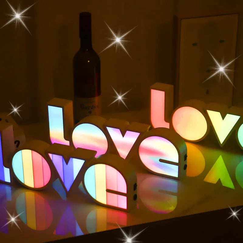 Rainbow style LOVE word LED decorative light with USB cable, measuring 35.5cm by 13.5cm.