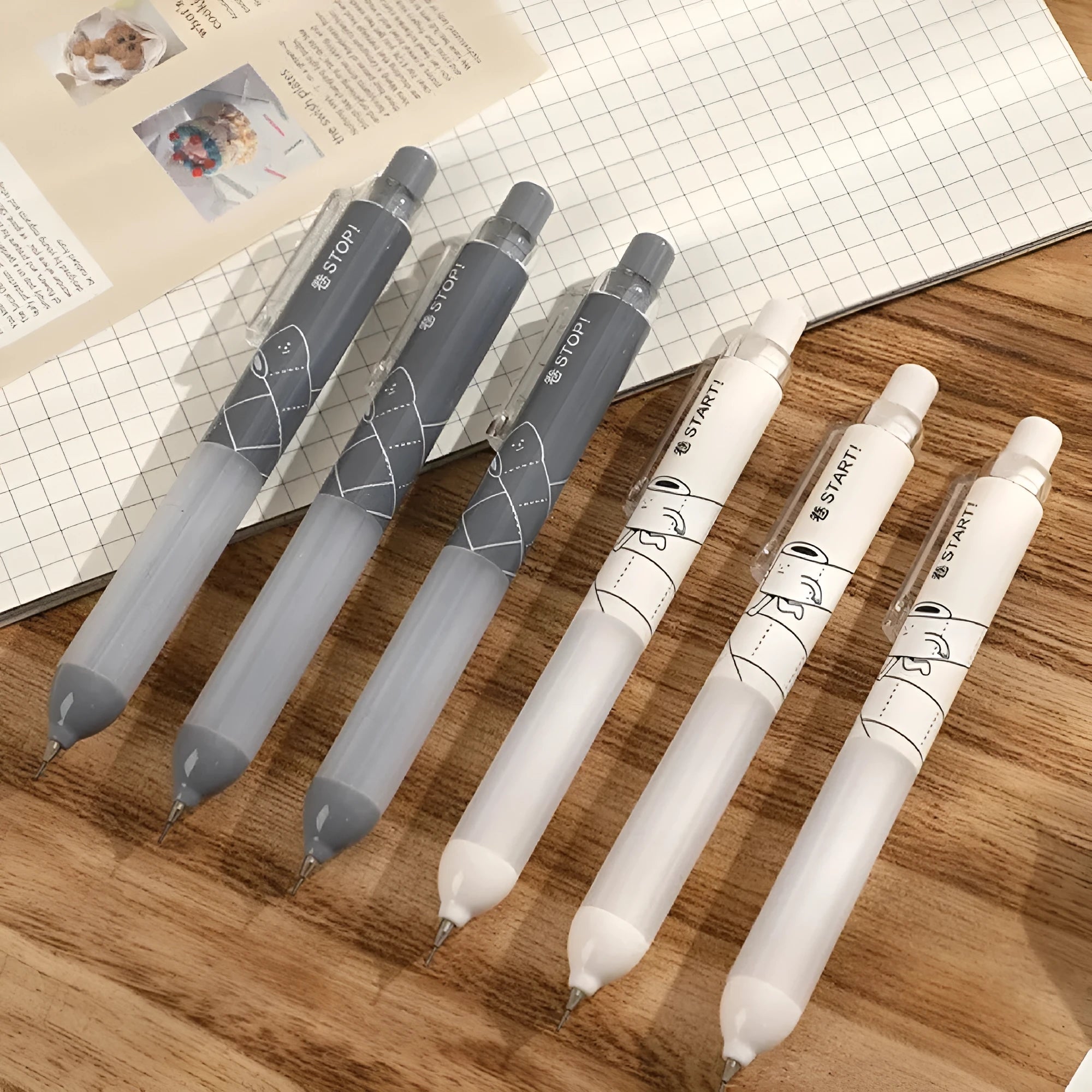 Minimalist black and white automatic pencils with cloud grip, showing 0.5mm HB lead specification.