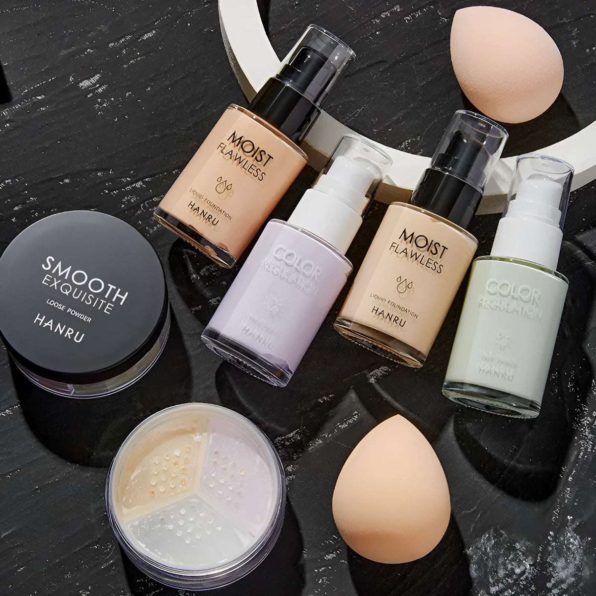 4-piece makeup set with liquid foundation isolation milk loose powder and beauty egg in ivory and green natural and purple colours