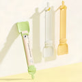 Cat strip feeder spoon in orange, green, and white, 27 x 6.5 cm reusable treat dispenser