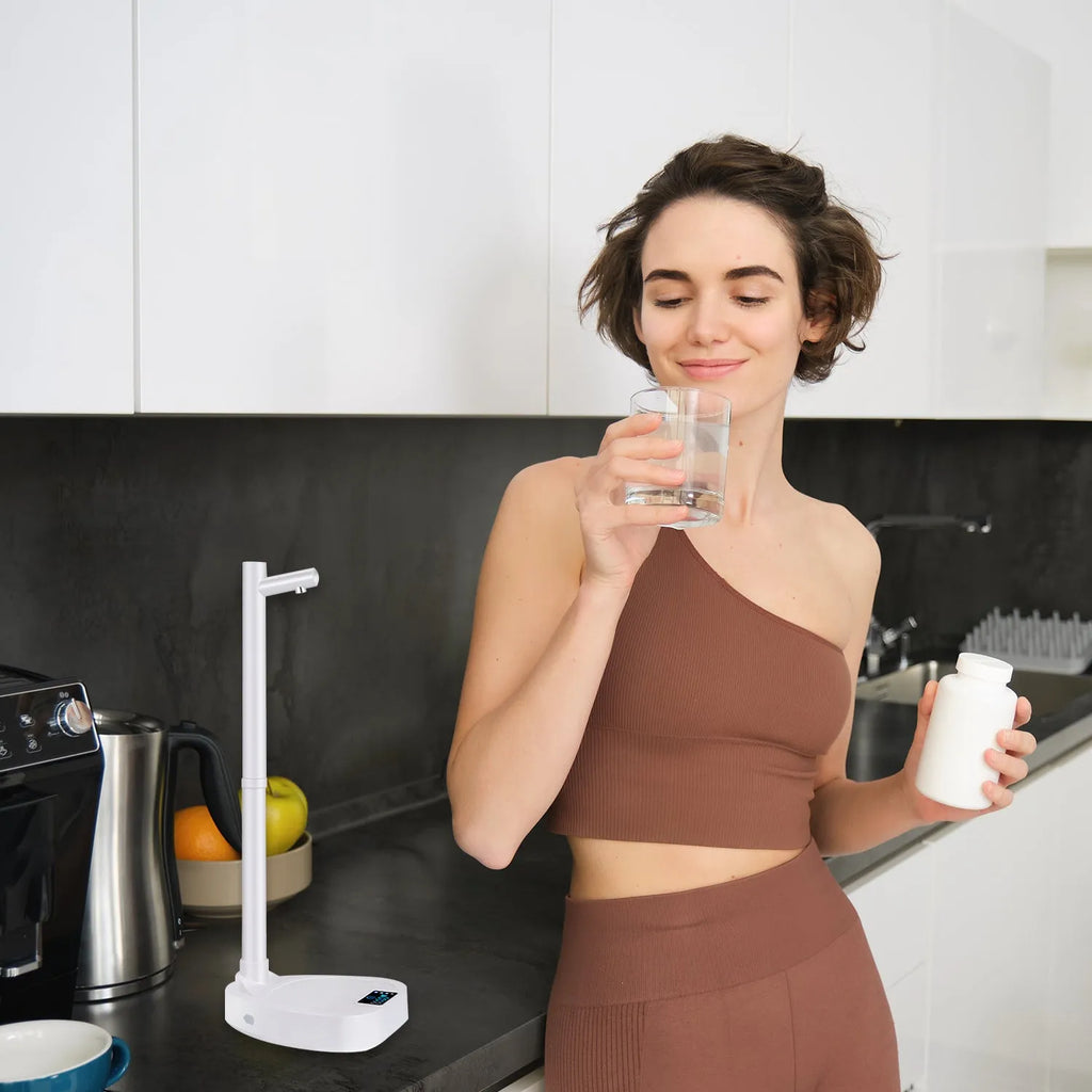 White and blue rechargeable desktop water dispenser pump with LED display on a water bottle.