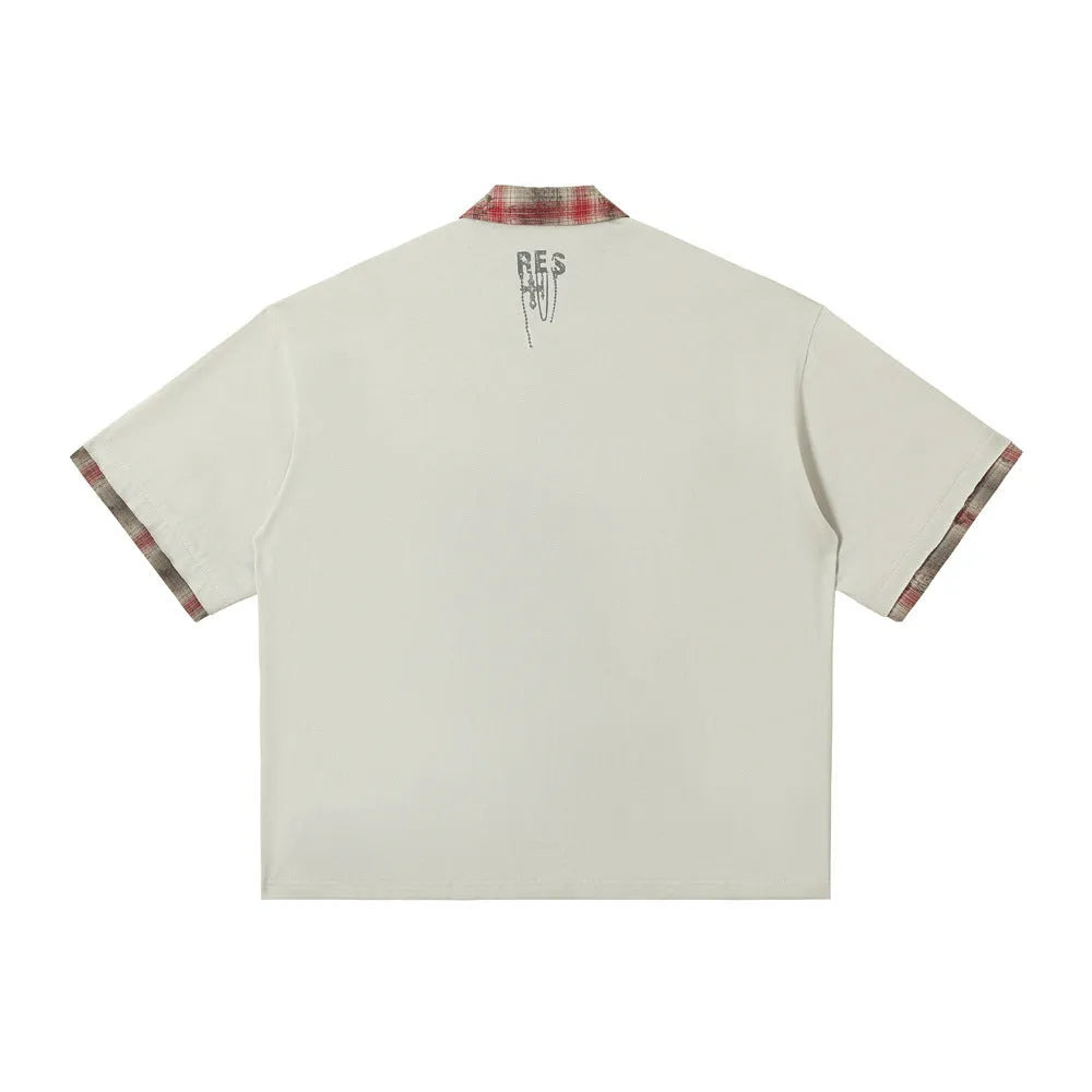 Men's loose blue cotton top with asymmetric cut and graffiti print on lapel.