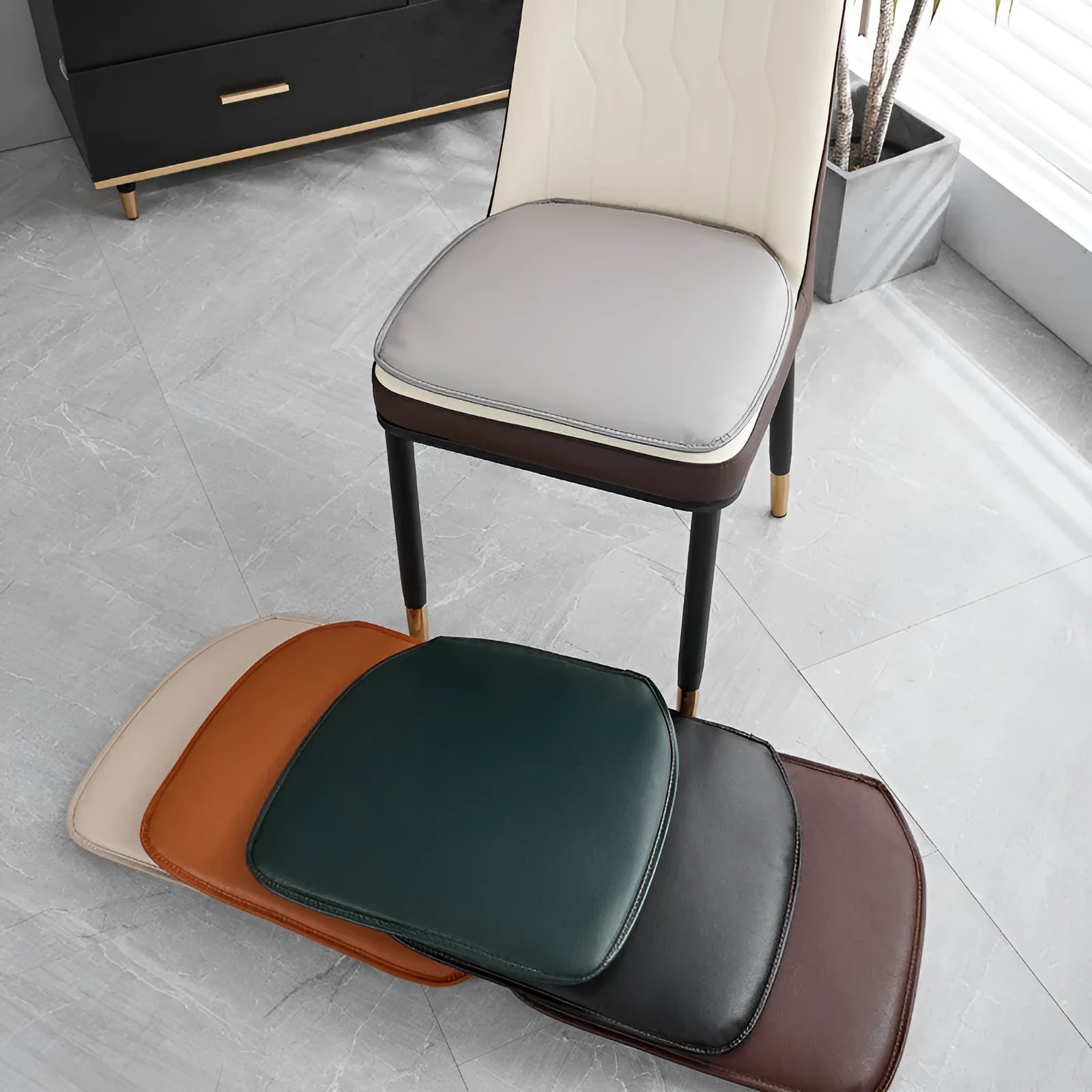 Leather horseshoe-shaped non-slip seat cushion on a chair, shown in beige colour.