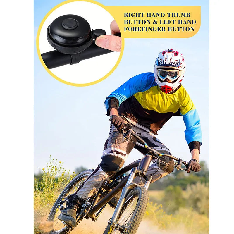 Black ABS plastic bicycle bell with 58mm diameter on a mountain bike handlebar fixture