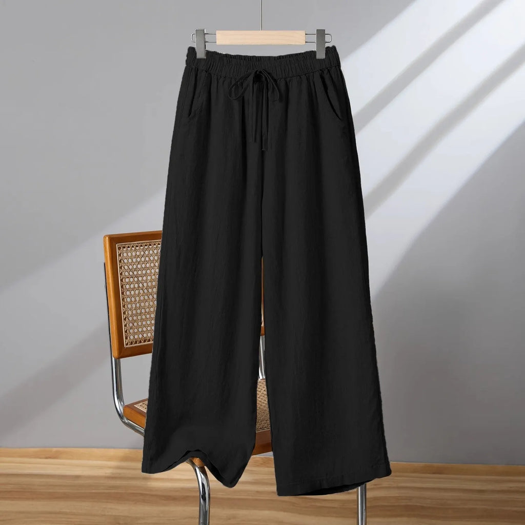 Women's apricot straight-leg casual trousers with elastic waist and front drawstring detail.