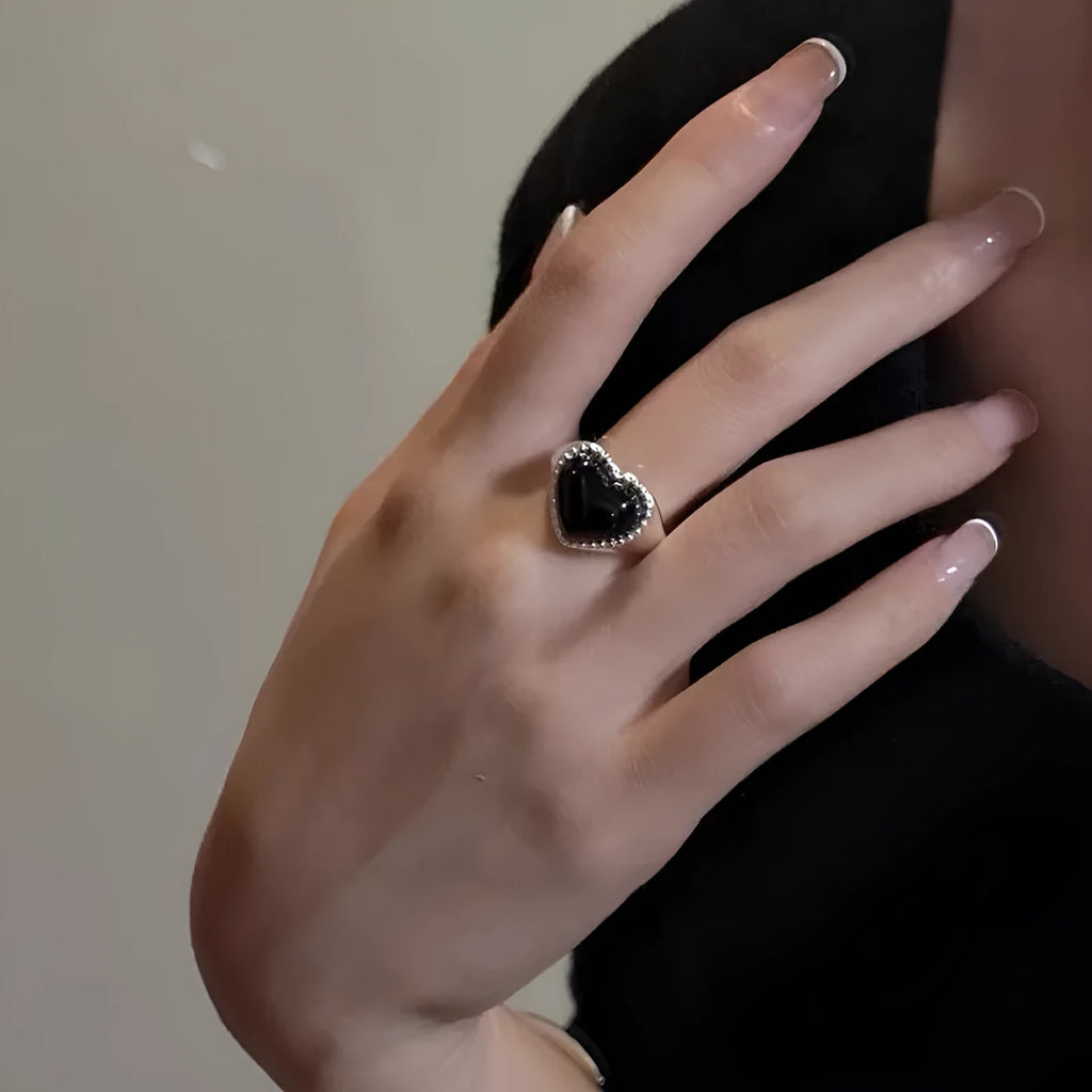 Adjustable open mouth ring with black agate stone and heart design in sterling silver