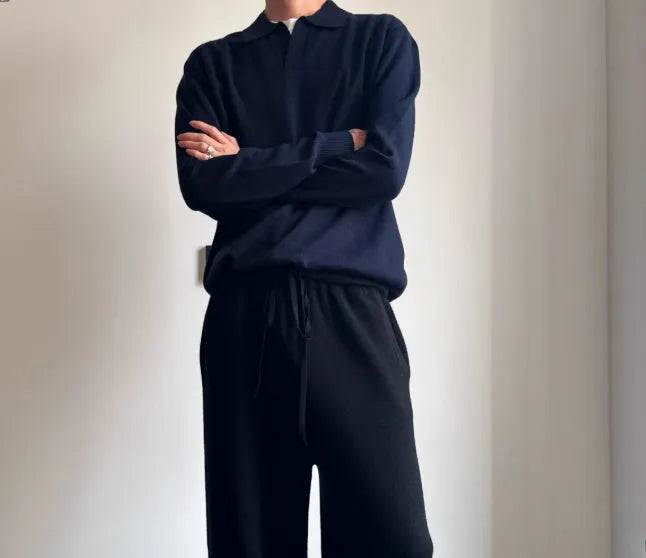Man wearing a milky white pure wool polo collar sweater with a lapel design.