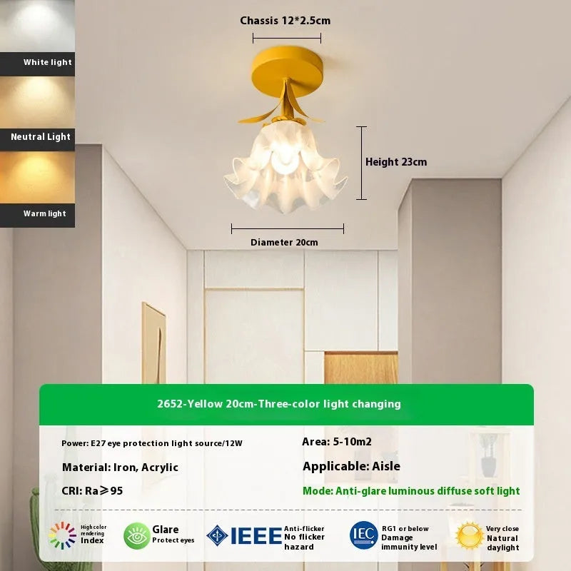 Cream coloured Linglan flower modern corridor wall light fixture on display.