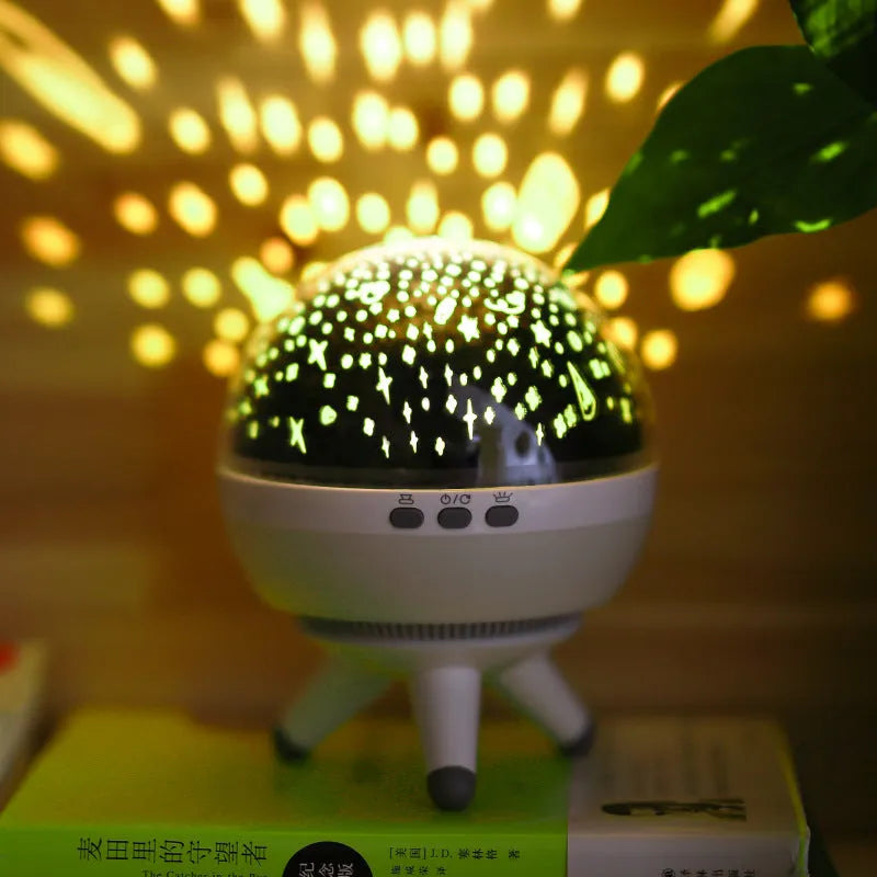 Black and white rotating starlight projection lamp showing starry sky light effect on wall