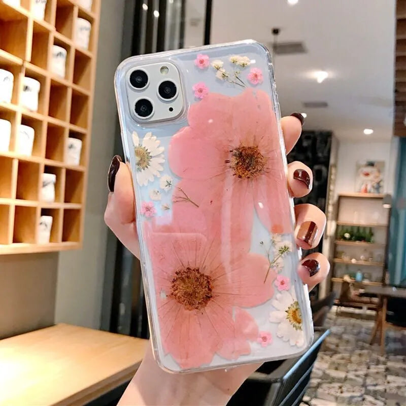 Pink and yellow floral print TPU back cover case for iPhone on a white background