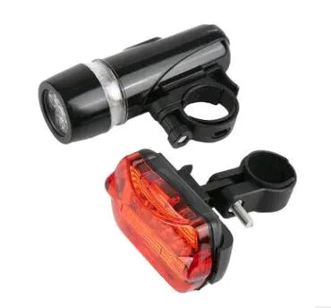 Black LED bicycle safety light set showing headlight, tail light, and clip-on back