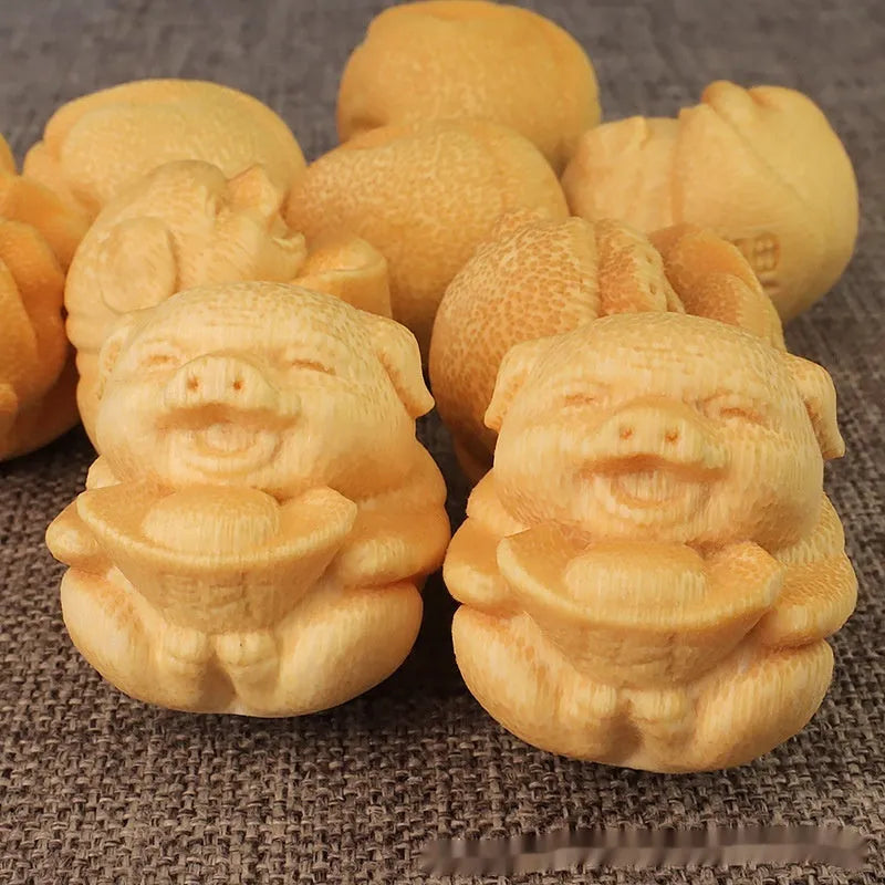 Solid bamboo carving ornament with ingot-shaped pig design measuring 4cm height