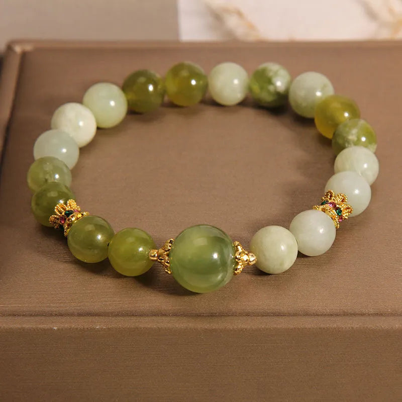 Women's bracelet made of green Xiuyan jade in an original sweet Mori style design.