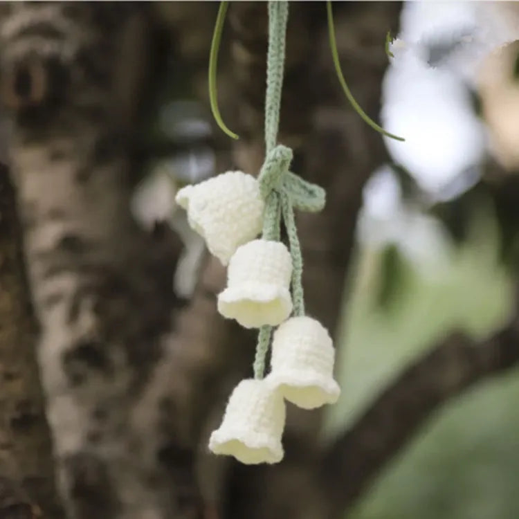 Green and white knitted wool car plant decoration with 8cm base and hanging rope.