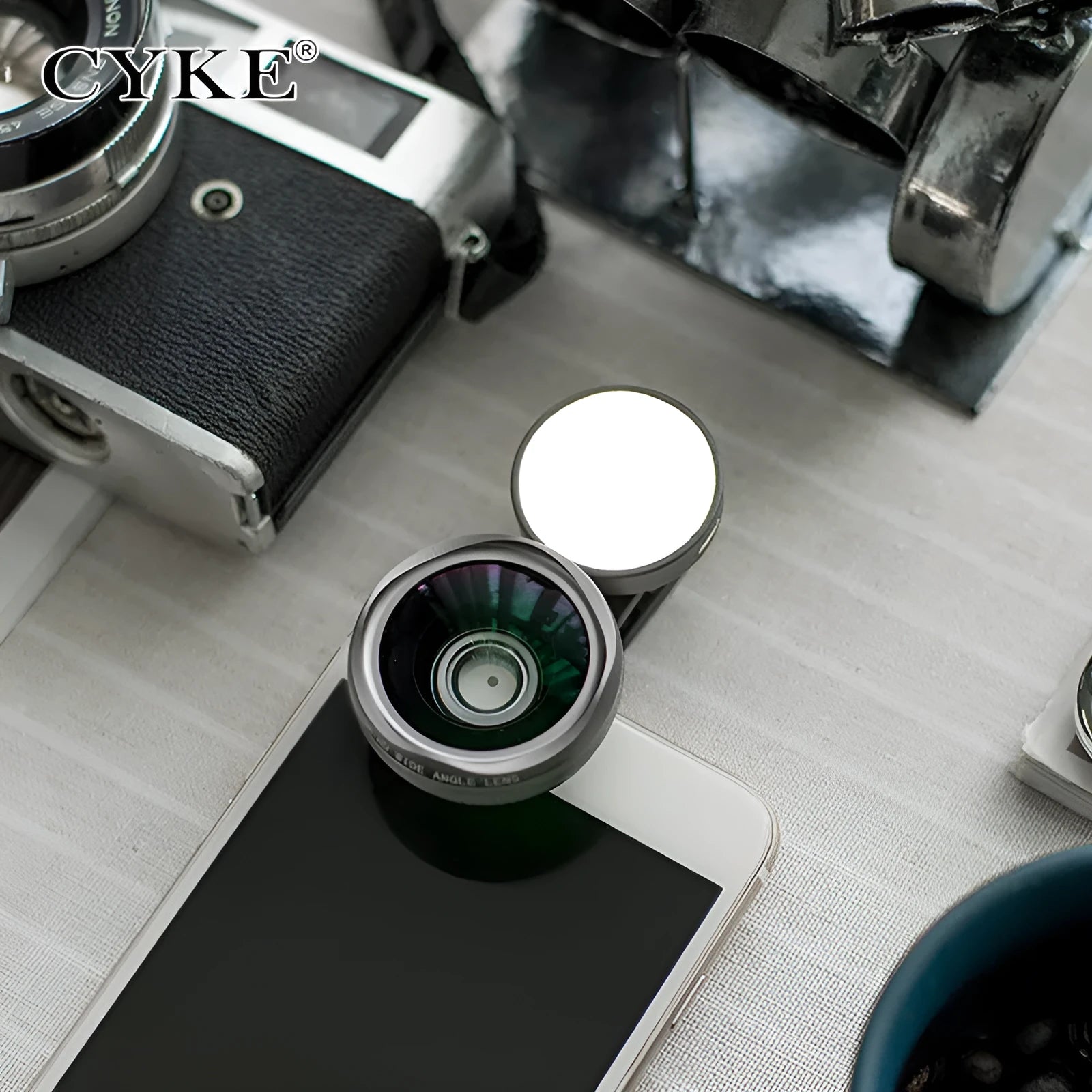 External clip-on mobile phone camera lens with wide-angle lens and colourful LED ring light.