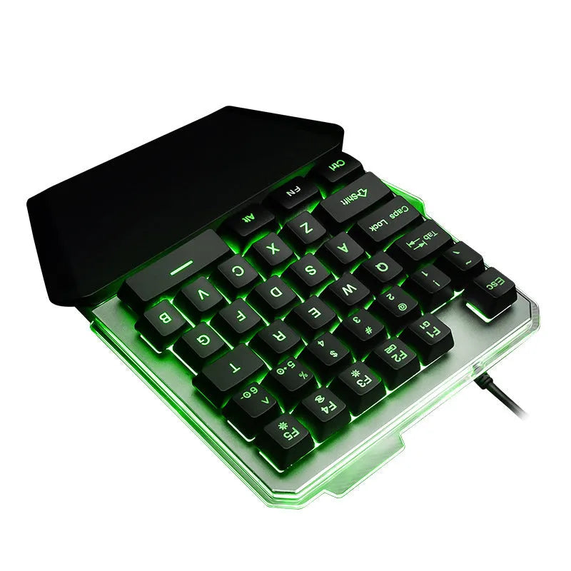 Black robotic one-handed mechanical keyboard with RGB backlit keys on a desk.