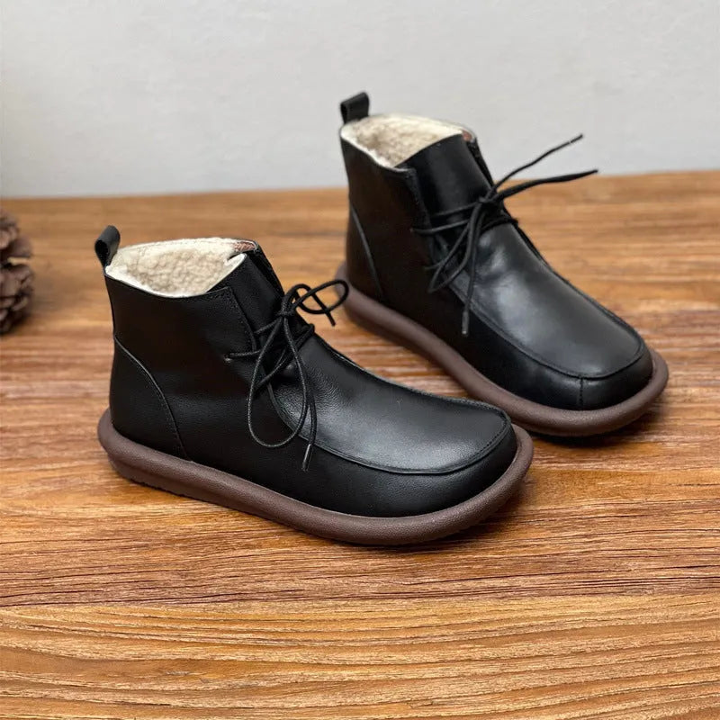 Women's cowhide boots in black and coffee colours with flat heel and round toe design