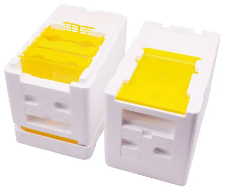 Three white EPS foam bee breeding boxes for hive mating and pollination.