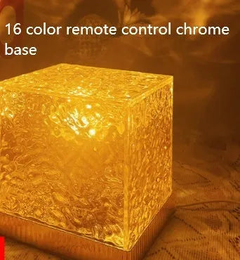 LED water ripple projection night light with remote control on wooden table