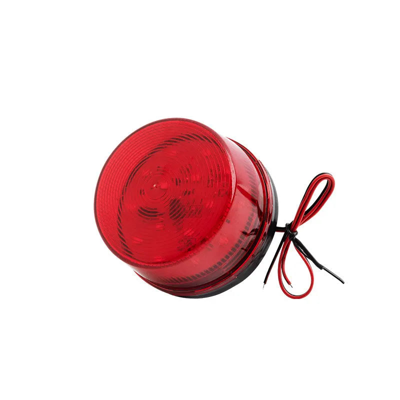 Small red warning alarm light with strobe flash, 73mm diameter, for 24V fire protection systems.
