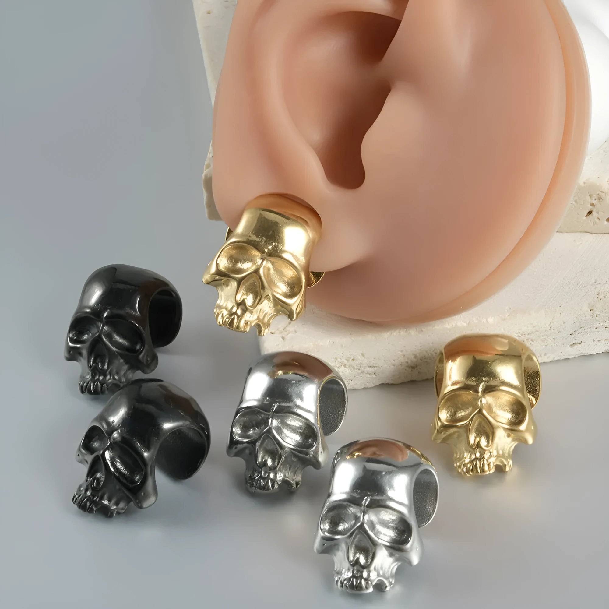 Stainless steel hollow skull and Buddha head geometric earrings for men and women.