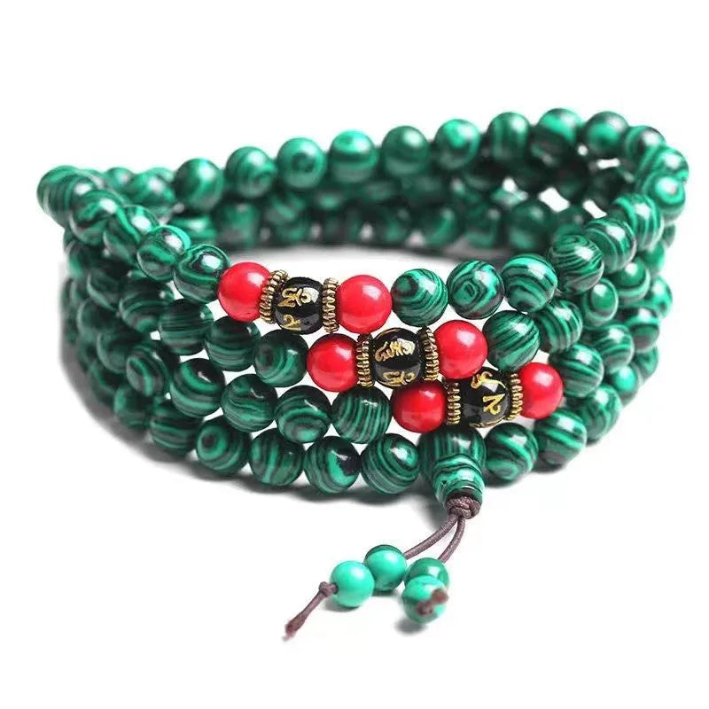 Turquoise 108-bead mala bracelet with polished round synthetic stone powder beads.