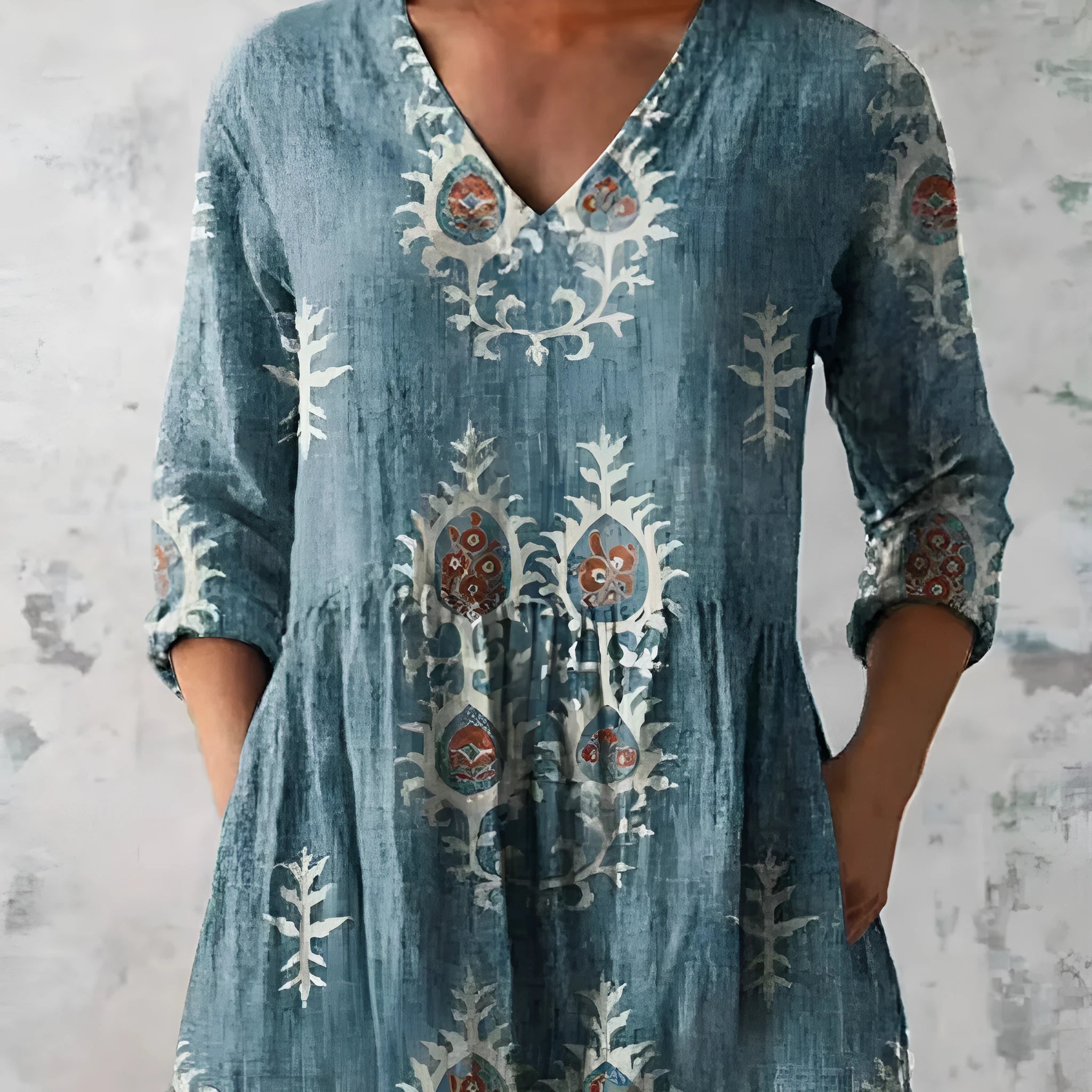 Women's loose-fitting long dress with a blue wave pattern print and 3/4 sleeves.