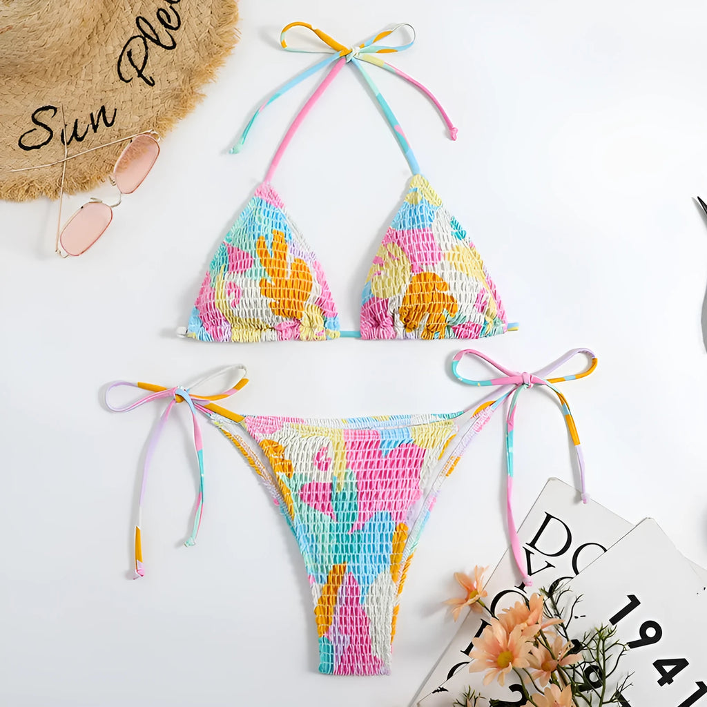 Women's multicolour floral triangle bag bikini swimsuit with split printed design and smocking craft detail.
