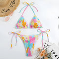 Women's multicolour floral triangle bag bikini swimsuit with split printed design and smocking craft detail.