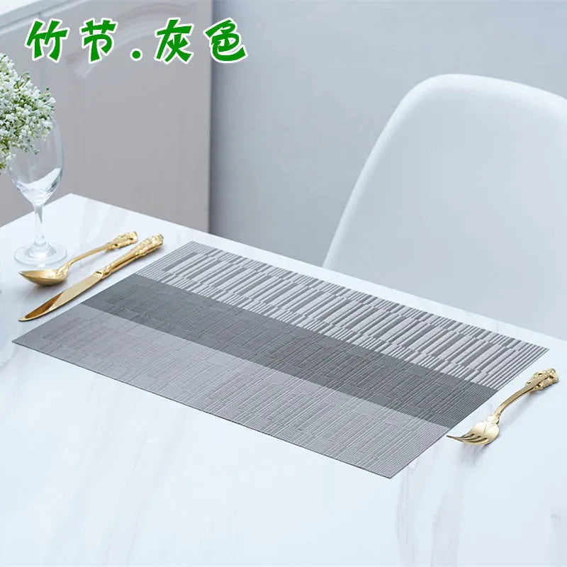 Modern non-slip PVC place mat on a dining table in gradient bamboo black colour.