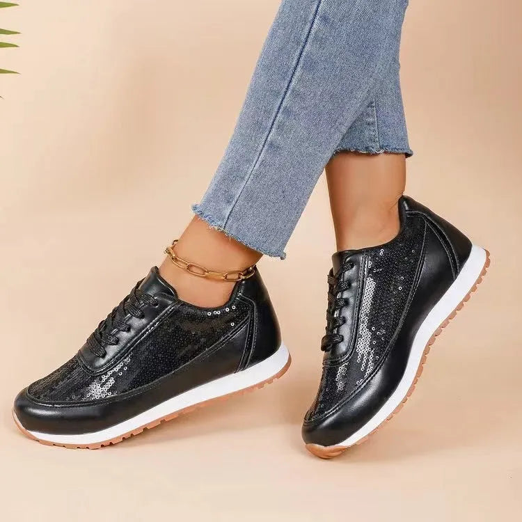Women's thick-soled black PU leather sneaker with a square toe on a white background.