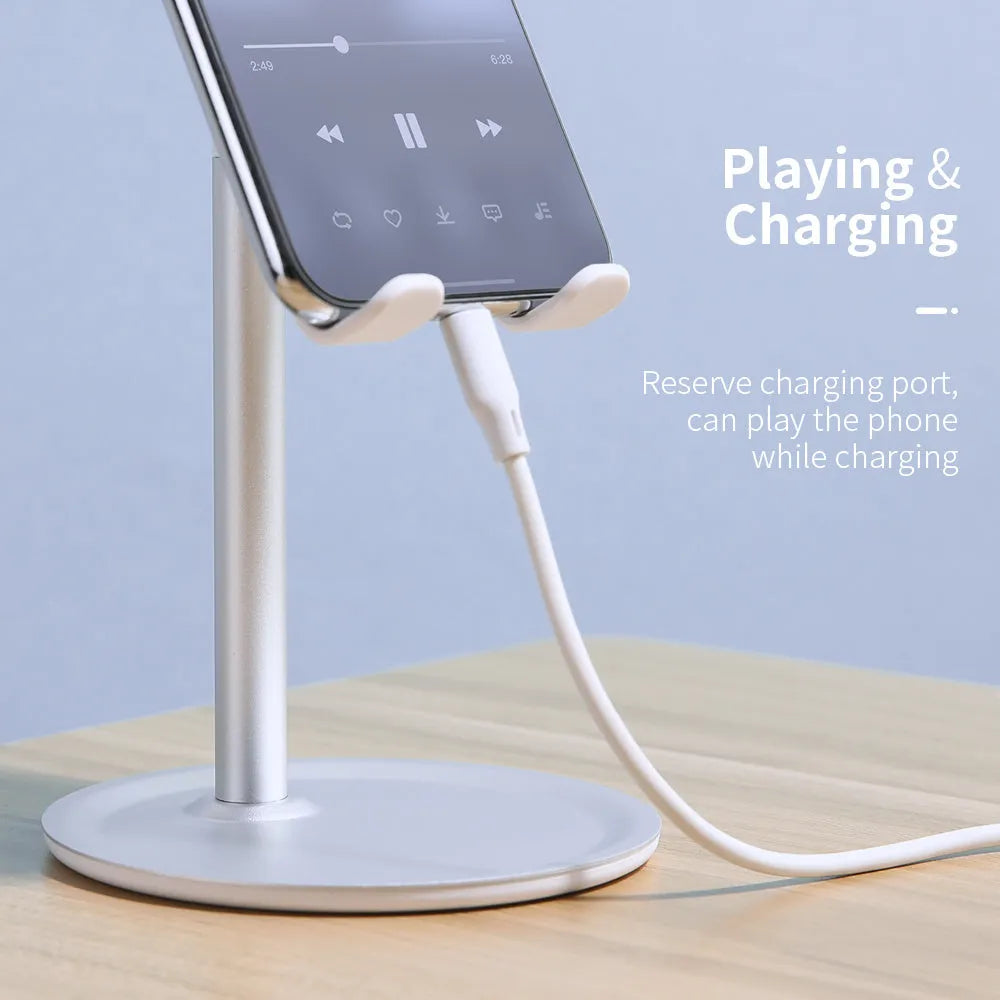 Aluminium alloy and plastic foldable stand holding a tablet on a desk