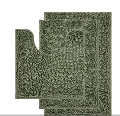 Dark green chenille U-shaped three-piece bathroom toilet carpet set on tiled floor.