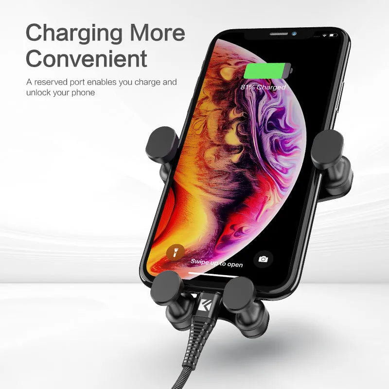 Black car phone holder with gravity bracket mounted on a car dashboard