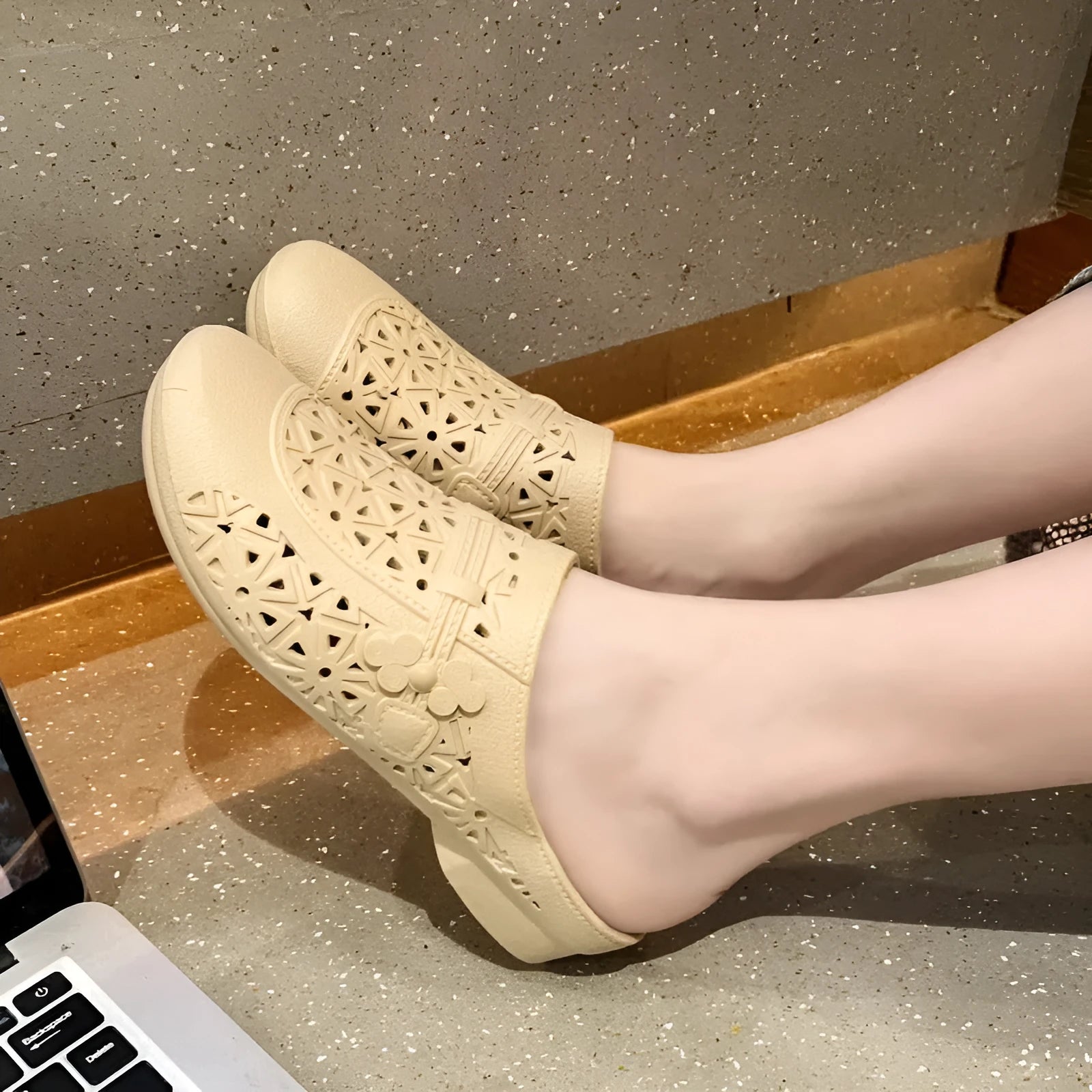 Adult flat toe box slippers in PVC with hollow-out design and faux fur collar.