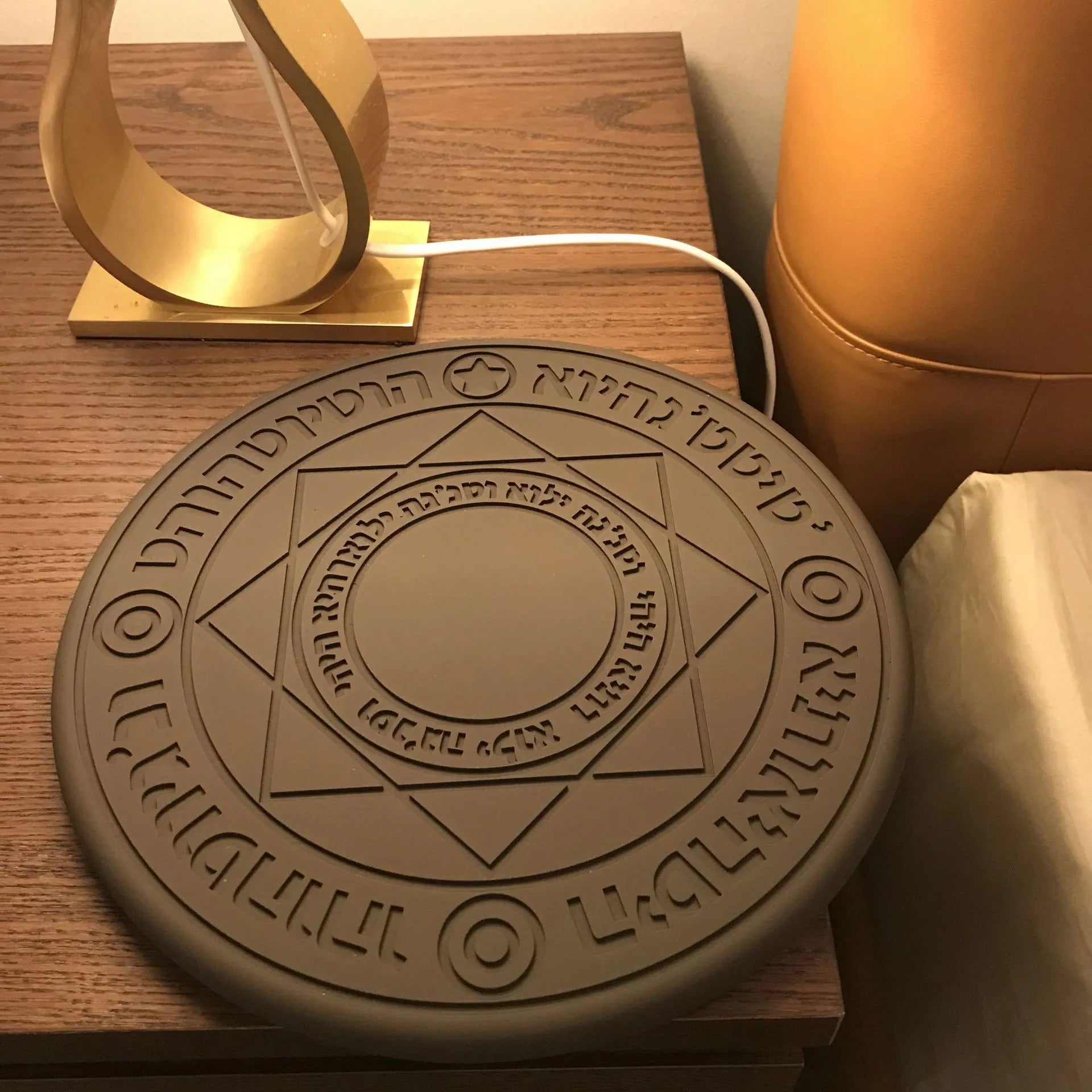 Square black 10W fast wireless charging pad with glowing magic array pattern for Qi phones