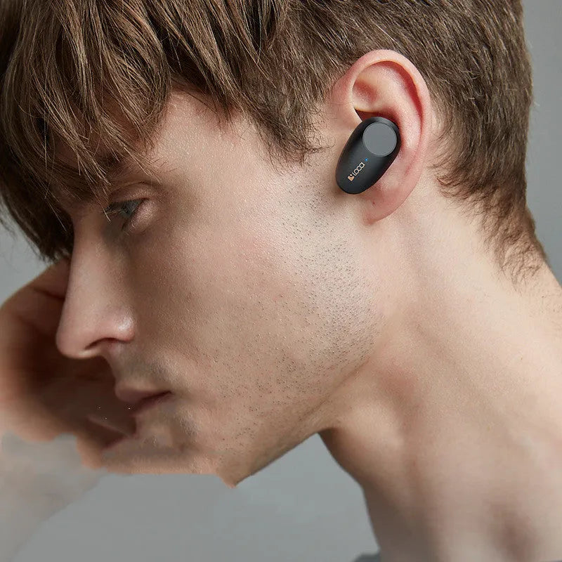 Black wireless Bluetooth headphones with ANC and a charging stand featuring type-C and wireless charging